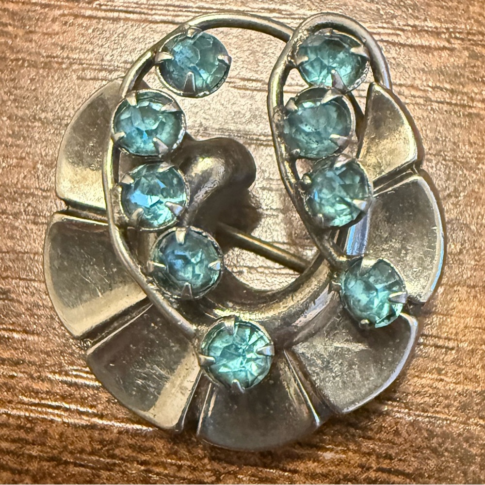 Vintage Silver Tone Abstract Brooch with Blue Rhinestones. 1940s to 1950s.